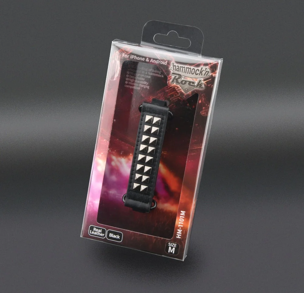 黒いリアルレザーにスタッズが施された、iPhoneとAndroid対応のスマートフォン用バンド「hammock'n Rock」のパッケージ画像です。Mサイズで、耐久性が高くワイヤレス充電にも対応しています。