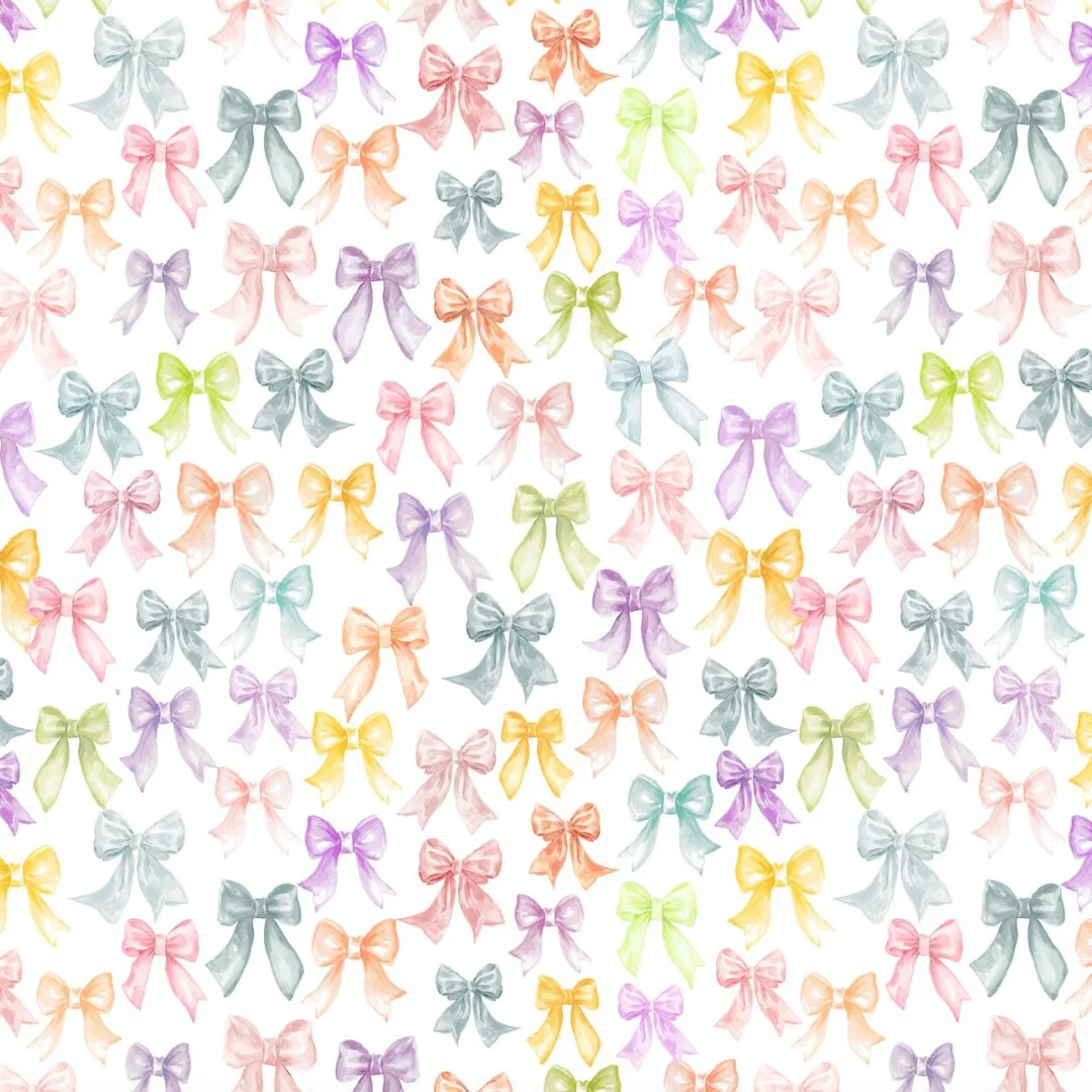 様々な色合いの小さなリボンが散りばめられた水彩画風のパターン