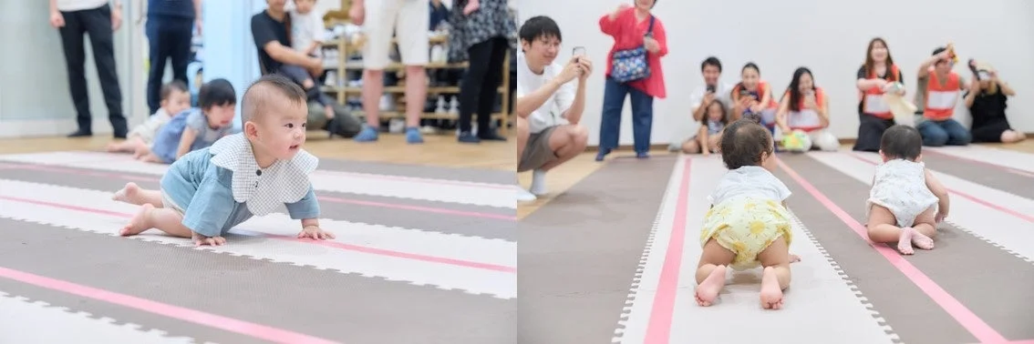 赤ちゃんがハイハイレースに参加している様子
