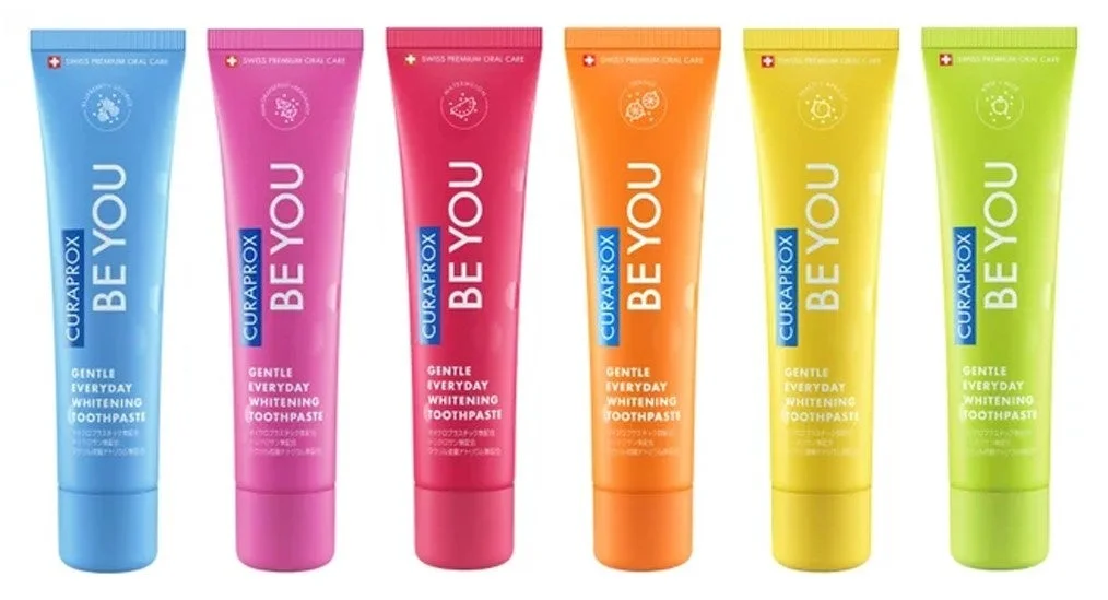 様々な色の「CURAPROX BE YOU」歯磨き粉が6本並べられた画像