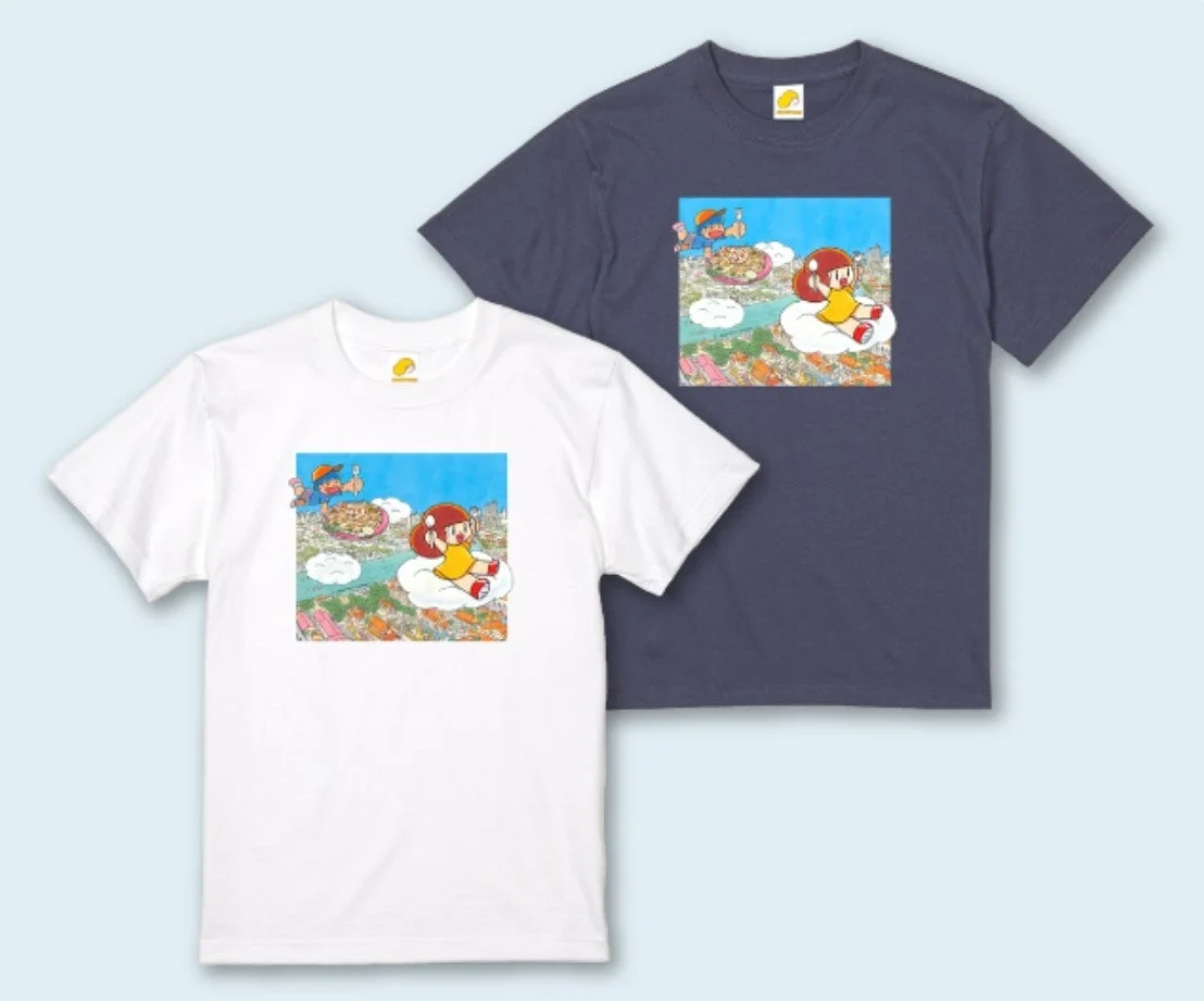 白と紺色のTシャツが並べられており、それぞれに空飛ぶ少年と雲に乗った少女、そしてピザが描かれた可愛らしいイラスト