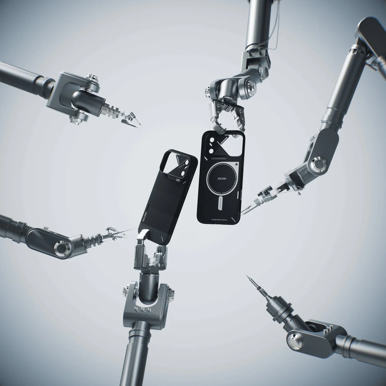 複数のロボットアームが黒いスマートフォンケースを精密に扱っている画像です。
